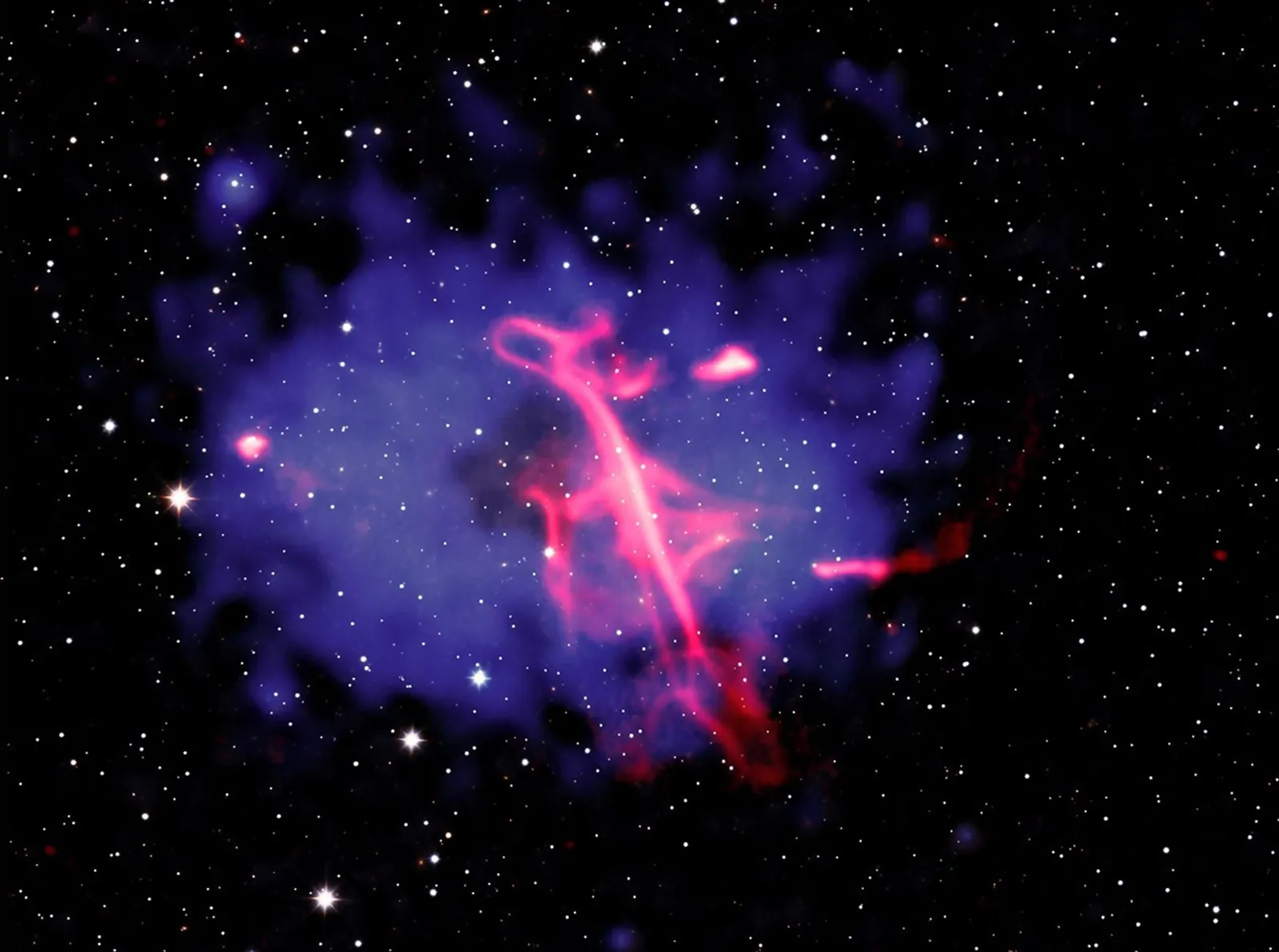 Using Chandra, astronomers have discovered that an outburst from a supermassive black hole, followed by a collision of two galaxy clusters, are the likely causes of an unusual formation in a galaxy cl