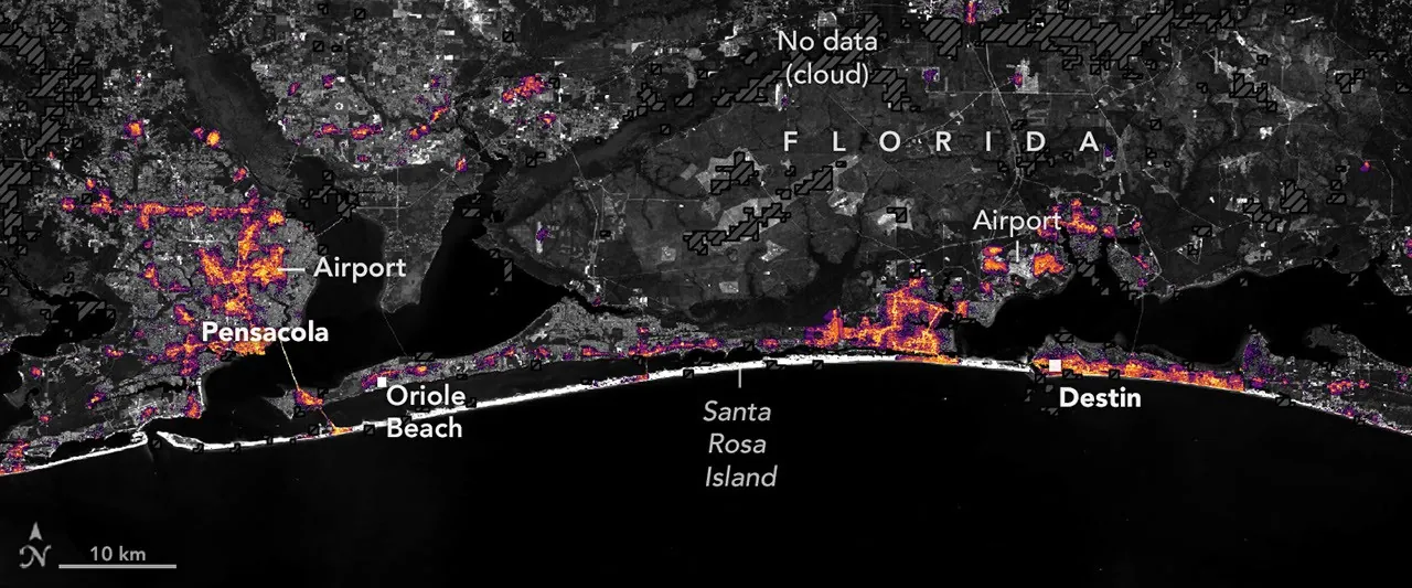 The same area on October 12, 2026, with lights in Pensacola and Destin and along the road between them closer to pre-storm levels.