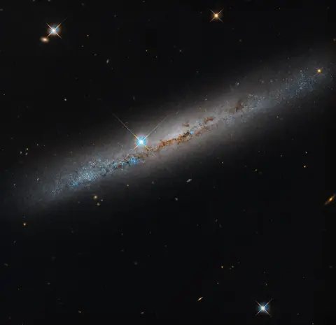 NASA’s Hubble Spies Spiral’s Edge