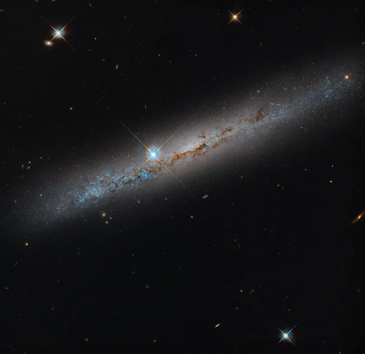 NASA’s Hubble Spies Spiral’s Edge