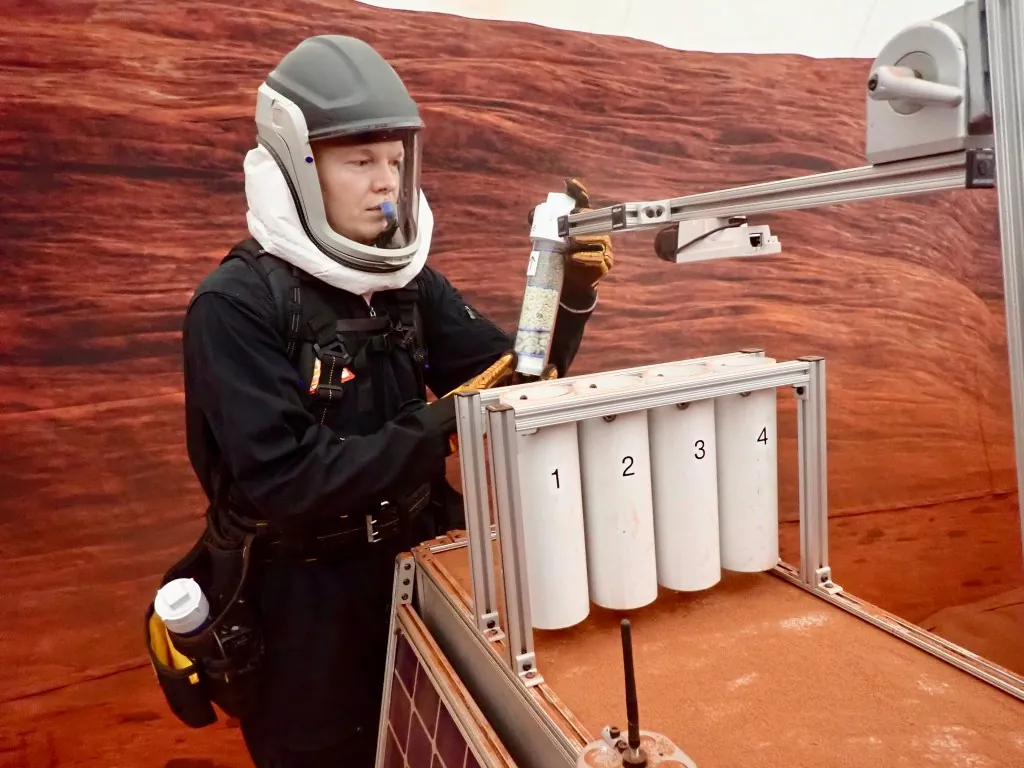 James Spicer, Crew Health and Performance Exploration Analog (CHAPEA) Mission 2 flight engineer, participates in an extravehicular geological activity.