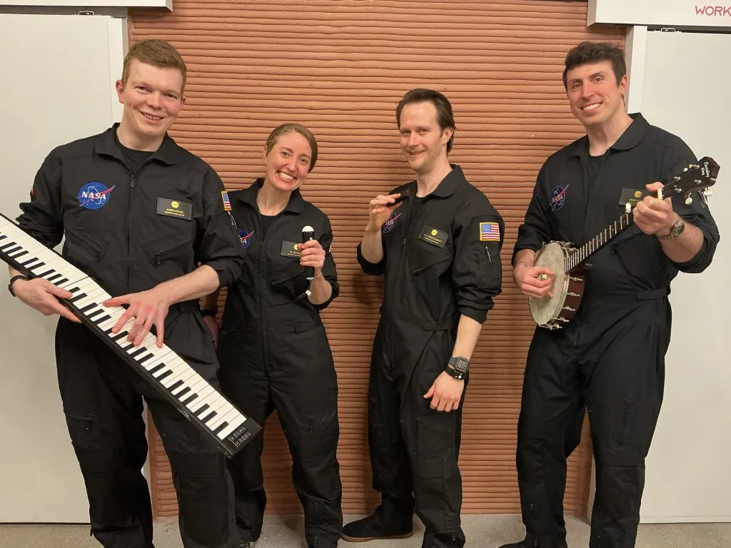 The CHAPEA crew showcases the instruments they brought on their mission. The crew elected to include instruments as part of their personal item allowance. From left: James Spicer, Ellen Ellis, Matthew