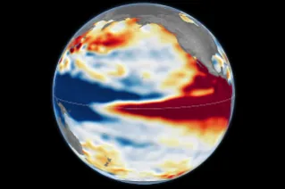 Side-by-side maps of the Pacific Ocean compare sea surface height anomalies in October 1997 (left) and October 2026 (right). In both, red areas of higher-than-normal sea surface height stretch across 