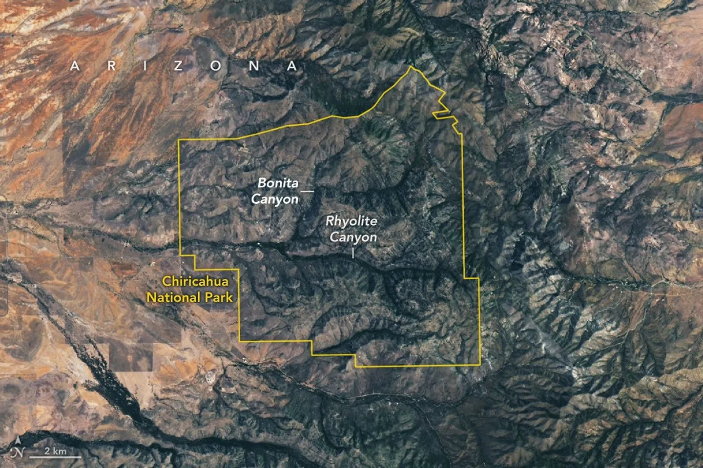A satellite image shows Chiricahua National Park outlined in yellow amid mountainous terrain. Within the park, gray ridges are cut by green, vegetated canyons, two of which are labeled Bonita Canyon a
